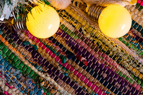 Chrismas garland lights over color carpet.
