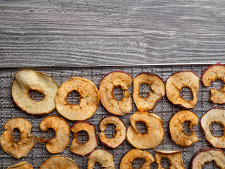 Wall Mural - dehydrated apple fruit in metal tray, close up