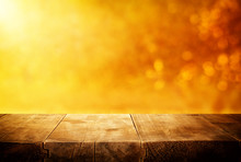 Background Of Wooden Table In Front Of Glitter Gold Bokeh Lights. For Product Presentation