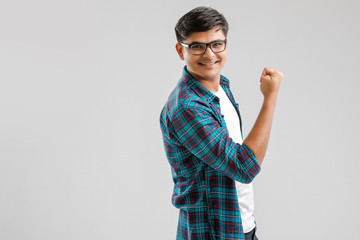 Sticker - Happy young Indian man over white background