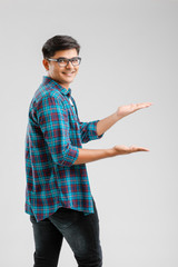 Sticker - Happy young Indian man over white background