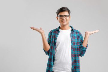 Sticker - Happy young Indian man over white background