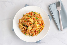 Chinese Style Fried Rice With Vegetables And Eggs Top View, White Background Horizontal Photo.