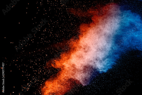 Colorful background of pastel powder explosion.Rainbow color dust splash on b...