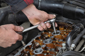 Wall Mural - Automotive, mechanic working on car engine