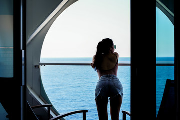 Sticker - woman relaxing on Cruise ship enjoying ocean view from  balcony