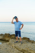 © Aliaksei Luskin - young man in hat posing on the seashore