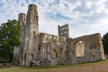 Sticker - tourists visit the ruins of the old abbey and Benedictine monastery at Jumieges in Normandy in France