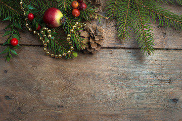 Wall Mural - Christmas holiday decorations and fir branch on the vintage wooden background with copy space