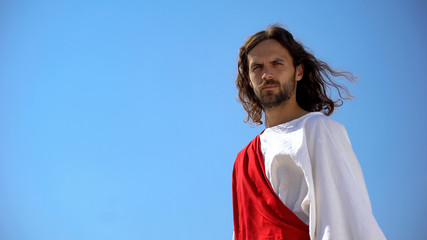 Wall Mural - Saint man looking into camera from above, template for religious inscriptions