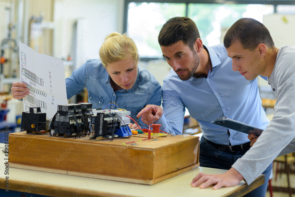 students and teacher looking at electronic circuit board Stock Photo ...