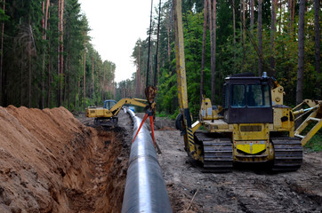 natural gas pipeline construction work. a dug trench in the ground for the installation and installa