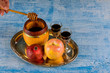 A jewish new year with honey for the apple and pomegranate holiday of Rosh Ha Shana