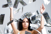 Woman With Lot Of Money. Millionaire Woman Lying In Bedroom. Sexy Woman Lying In Dollar Bills. Rich Sexy Woman Lies On Money. Currency, Women, Winning. Sexy Female And Dollar Bills