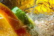 Carbonated drink or cocktail with lemon, abstract splashing.