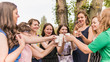 © creative_content - Group of girlfriends toasting with champagne in paper glass. Young people celebrating with champagne at party outdoors. Concept of hen-party