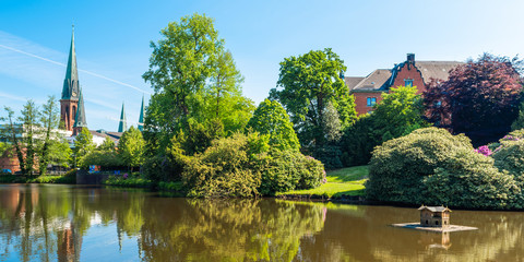 Wall Mural - View of the pond and St. Lamberti Church of Oldenburg, Germany.