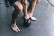 © StockPhotoPro - Man exercising with a kettlebell at the gym