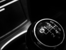 The Handle Of The Manual Transmission In A Black Car With A Gearshift Scheme. Soft Artistic Focus. Reverse Gear In Focus.