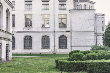 Wall Mural - Wall with windows of an old white building