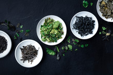 Various Dry Seaweed, Sea Vegetables, Shot From The Top On A Black Background With A Place For Text