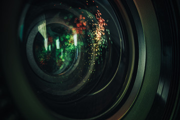 Poster - Close up beautiful camera aperture lens with multi colored light glass reflection. Macro view.
