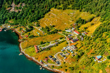 Wall Mural - Beautiful aerial landscape view Geiranger village, harbor and fjord in More og Romsdal county in Norway.