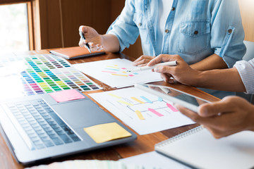 business technology concept, creative team designer choosing samples with UI/UX developing on sketch layout design mockup on smartphone application for mobile user interface design chart.
