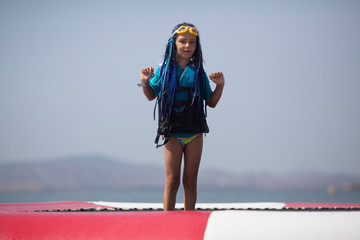 Wall Mural - Girl 7 years in sea water park