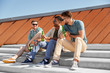 © Syda Productions - leisure, male friendship and people concept - happy men or friends drinking beer and talking on street in summer