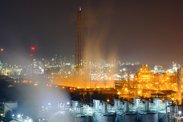 Wall Mural - Factory of power and energy industrial at night. Petrochemical plant at twilight.