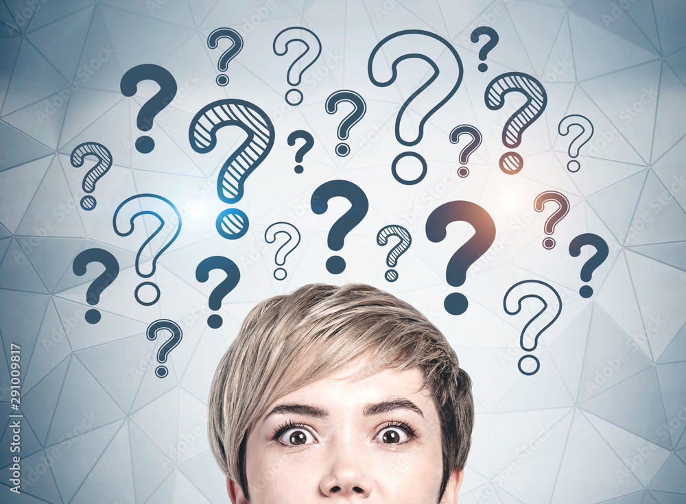 Astonished young woman and question marks Stock Photo | Adobe Stock