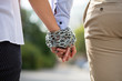 Couple's Hand Tied With Metal Chain