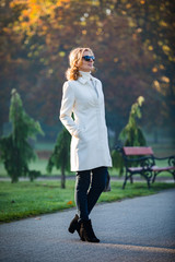 Wall Mural - middle-aged woman walking in city park