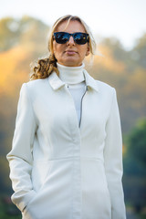 Wall Mural - middle-aged woman walking in city park