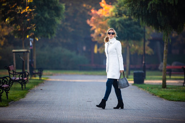 Wall Mural - middle-aged woman walking in city park