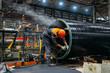 © Mulderphoto - Worker installs clamping ring on coated pipe