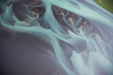 Aerial Views Of Glacier River Patterns In Iceland