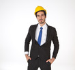 © supAVADEE BUTRADEE - A handsome businessman wearing a helmet and an engineer standing confident with success