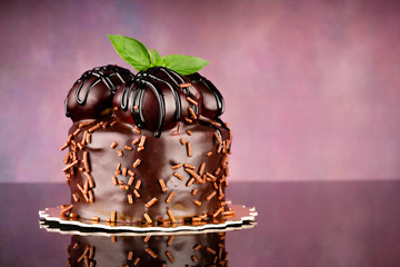 delicious cake with chocolate on vintage background