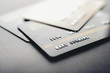© Johnstocker - Credit cards that are stacked on the floor,selective focus