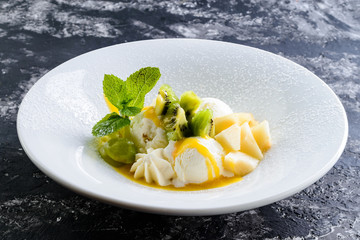 Poster - dessert with fresh fruits and mint in a plate