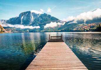 Beautiful autumn scene of Altausseer See lake Trisselwand peak on background. Misty morning view of Altaussee village, district of Liezen in Styria, Austria, Europe. Orton Effect.