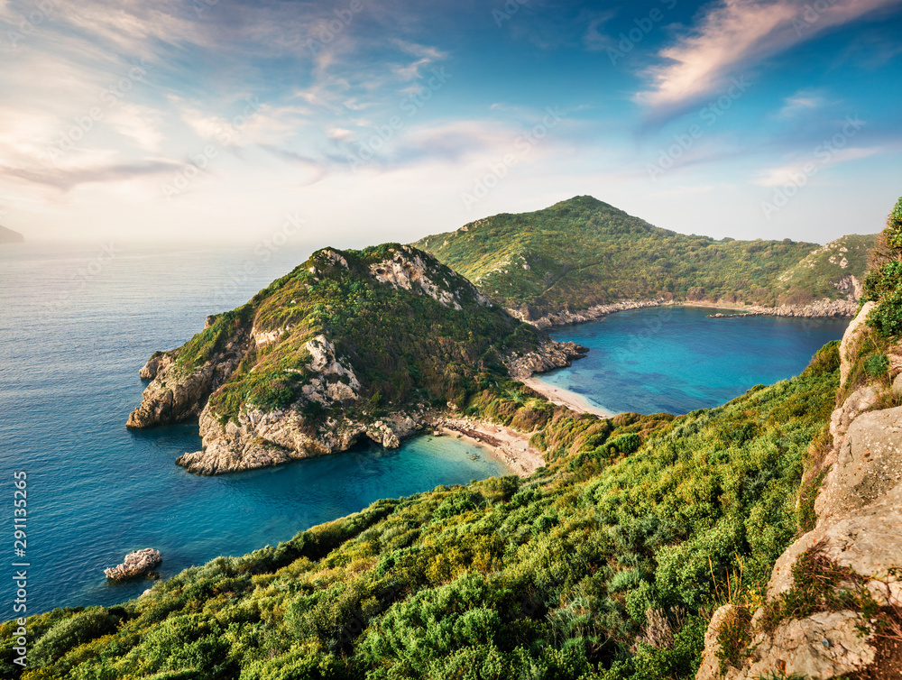 Fabulous spring view of Pirates Bay, Afionas village location.Perfect morning seascape of Ionian Sea. Fantastic outdoor scene of Corfu island, Greece, Europe. Beauty of nature concept background. - obrazy, fototapety, plakaty 