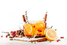 Winter Or Autumn Healing Hot Tea With Lemon, Cranberries, Thyme And Spices, White Background, Copy Space, Selective Focus