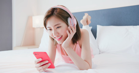 Sticker - woman enjoy music by smartphone