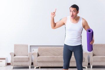 Young man training and exercising at home