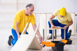 © Elnur - Two contractors carpenters working indoors