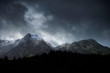 Stunning moody dramatic Winter landscape image of snowcapped Y Garn mountain in Snowdonia
