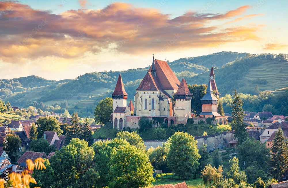 Splendid summer view of Fortified Church of Biertan, UNESCO World Heritage Sites since 1993. Colorful morning cityscape of Biertan town, Transylvania, Romania, Europe. Traveling concept background. - obrazy, fototapety, plakaty 